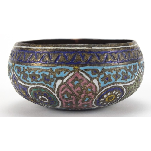 579 - Islamic copper bowl, enamelled with flowers amongst foliate motifs, 11cm in diameter