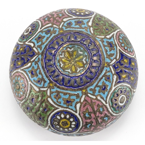 579 - Islamic copper bowl, enamelled with flowers amongst foliate motifs, 11cm in diameter