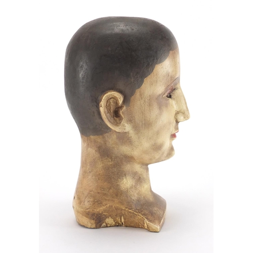 79 - Early 20th century hand painted carved wooden mannequin bust, 27.5cm high