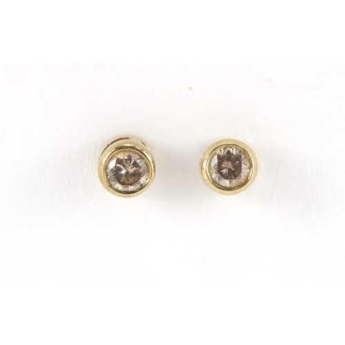 2803 - Pair of 9ct gold diamond solitaire earrings, approximate weight 0.8g