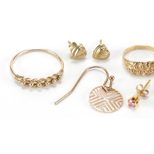 2716 - Three pairs of 9ct gold earrings, two 9ct gold rings and one other earring, approximate weight 3.0g