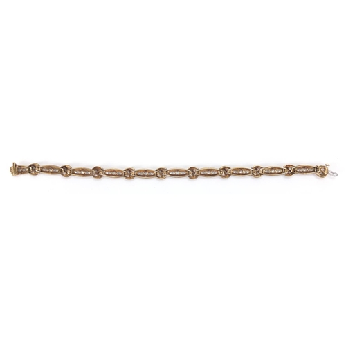 2665 - 10ct two tone gold diamond bracelet, 19cm in length, approximate weight 12.5g