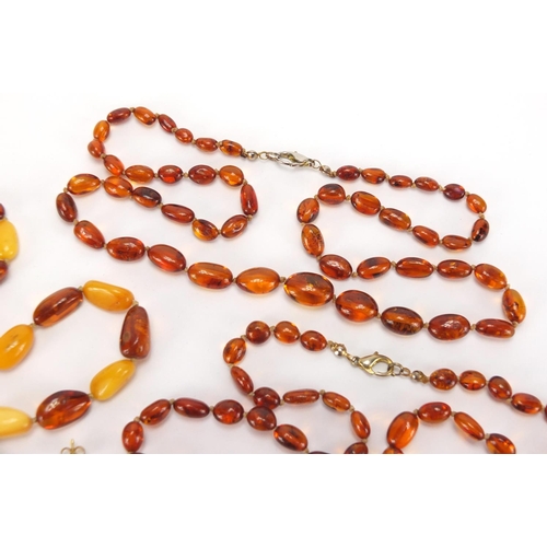 2728 - Natural and butterscotch amber coloured bead necklaces, pendants and earrings, approximate weight 65... 