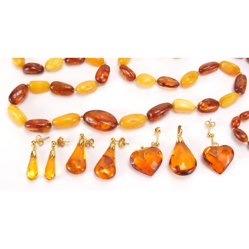 2728 - Natural and butterscotch amber coloured bead necklaces, pendants and earrings, approximate weight 65... 