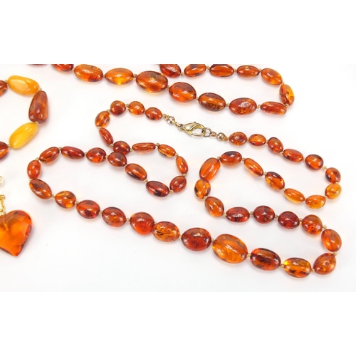 2728 - Natural and butterscotch amber coloured bead necklaces, pendants and earrings, approximate weight 65... 