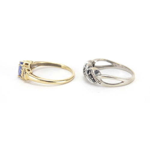 2739 - 9ct gold tanzanite and diamond ring and an unmarked gold black and clear stone crossover ring, sizes... 