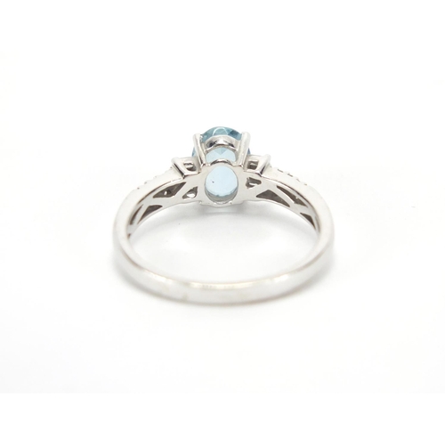 2776 - 18ct white gold blue stone and diamond ring, size O, approximate weight 3.4g