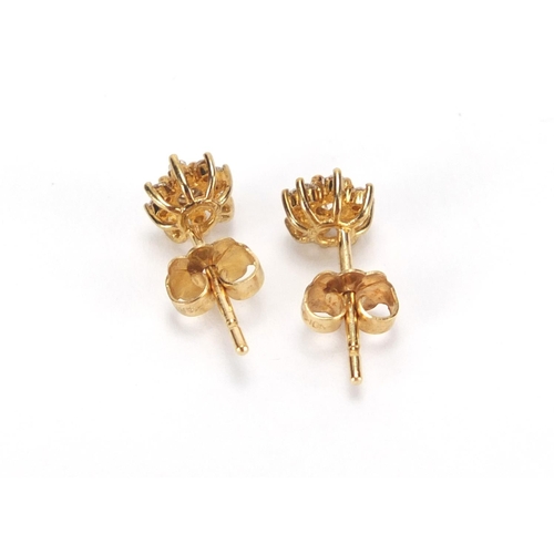 2778 - Pair of 9ct gold diamond flower head earrings, 6mm in diameter, approximate weight 1.0g