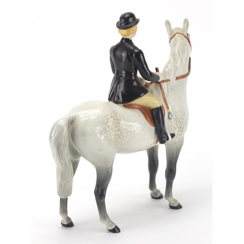 2418 - Beswick huntswoman on horseback, 21.5cm high