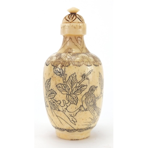 2506 - Oriental carvings and seals including a bone scent bottle, decorated with birds of Paradise, three N... 