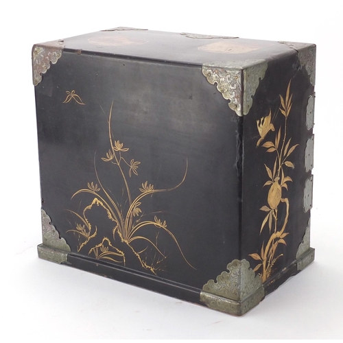 2161 - Japanese lacquer and gold dusted table cabinet, with a pair of doors opening to reveal an arrangemen... 