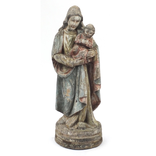 2071 - Floor standing carved wooden model of Madonna and child,  hand painted, 103cm high