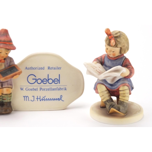 2424 - Three Goebel Hummel figures including hand painted porcelain figures and a authorised retailer plaqu... 