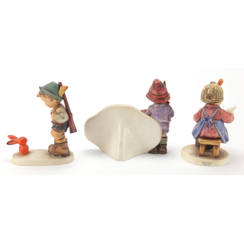 2424 - Three Goebel Hummel figures including hand painted porcelain figures and a authorised retailer plaqu... 