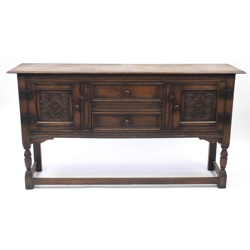 2010 - Ipswich oak sideboard with carved panelled doors and two centre drawers, 91.5cm H x 168cm W x 42.5cm... 