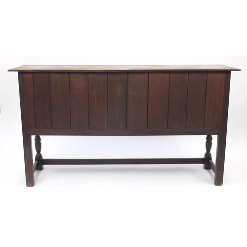 2010 - Ipswich oak sideboard with carved panelled doors and two centre drawers, 91.5cm H x 168cm W x 42.5cm... 