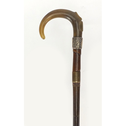 108 - Horn handled walking stick with silver collar and brass ferrule, possibly rhino horn, 91cm in length