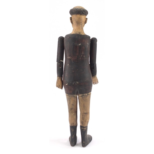 76 - Spanish colonial polychrome painted carved wooden mannequin, with beaded glass eyes, 65cm in length