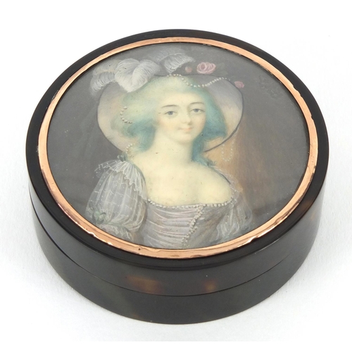 17 - 18th century circular tortoiseshell portrait snuff box with gold coloured mount, the lid hand painte... 