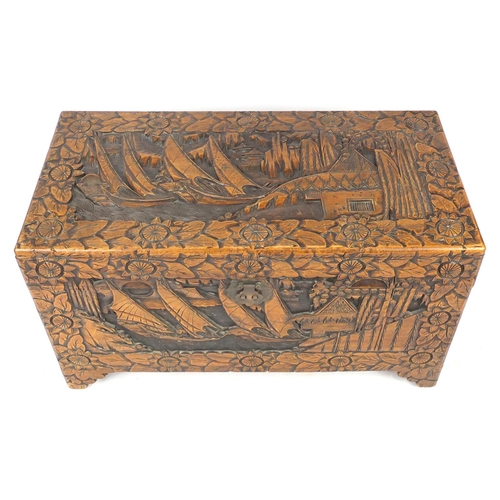 2079 - Rectangular Chinese Camphorwood chest with twin handles carved with junks and flowers, 56.6cm H x 10... 