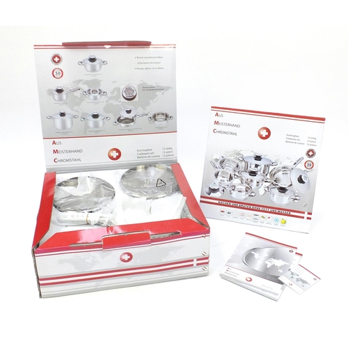 2128 - As new Swiss twelve piece chrome cookware set, with box