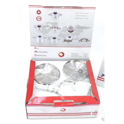 2128 - As new Swiss twelve piece chrome cookware set, with box