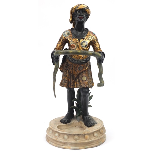 2001 - Floor standing umbrella stand in the form of a Blackamoor holding a serpent, 124cm high