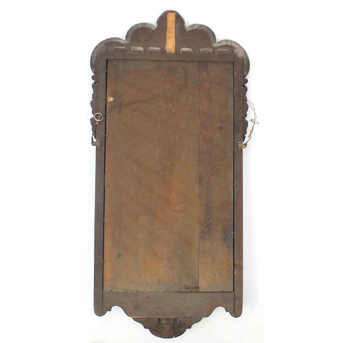 2025 - 18th century walnut pier mirror with shell crest and candle shelf, 98cm high x 48cm wide