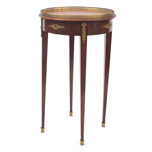 2066 - French circular mahogany occasional table, with gilt metal mounts raised on square tapering legs, 72... 