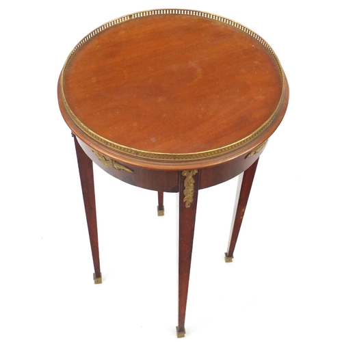 2066 - French circular mahogany occasional table, with gilt metal mounts raised on square tapering legs, 72... 