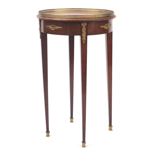 2066 - French circular mahogany occasional table, with gilt metal mounts raised on square tapering legs, 72... 