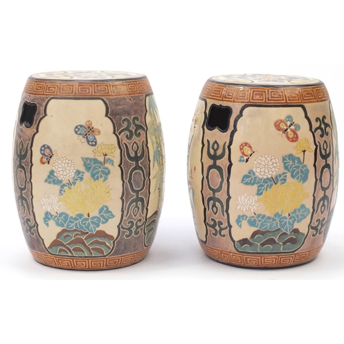 2091 - Pair of Asian ceramic garden seats in the form of drums, each hand painted and incised with panels o... 