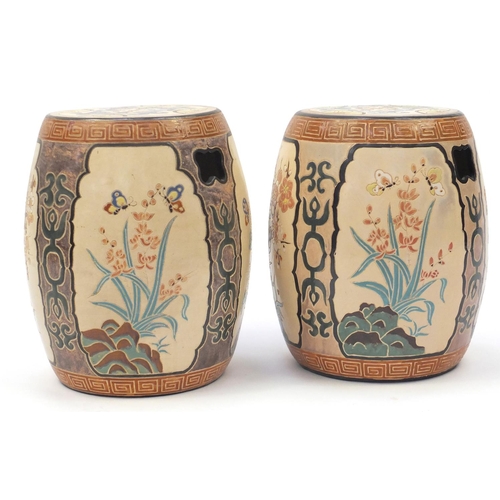 2091 - Pair of Asian ceramic garden seats in the form of drums, each hand painted and incised with panels o... 