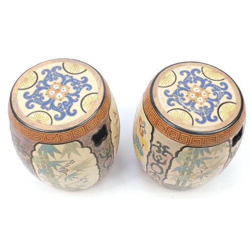 2091 - Pair of Asian ceramic garden seats in the form of drums, each hand painted and incised with panels o... 