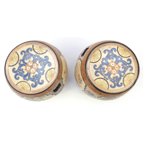 2091 - Pair of Asian ceramic garden seats in the form of drums, each hand painted and incised with panels o... 