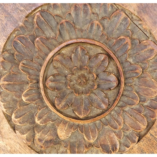 2076 - Indian hardwood octagonal folding table profusely carved and pierced with flowers, 56.5cm high x 55c... 