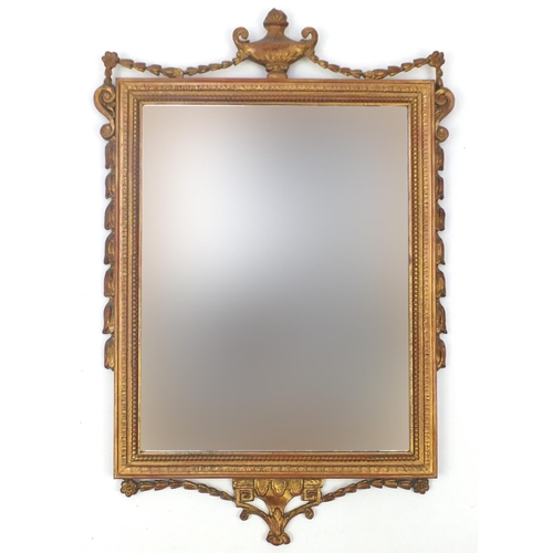 2068 - Ornate gilt framed bevelled mirror, with urn and swag design, 71cm x 45cm