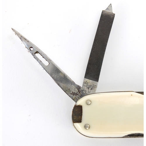 20 - 19th century ivory flanked multi-tool, with various tools including knives, corkscrew, tweezers and ... 