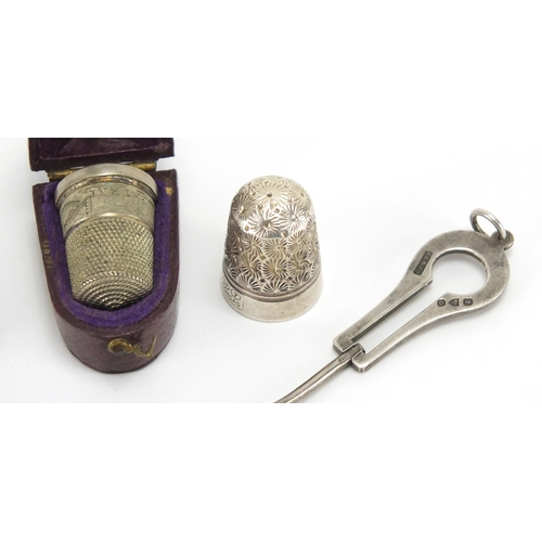 40 - Silver objects and two thimbles, one housed in a velvet lined leather case comprising chatelaine whi... 