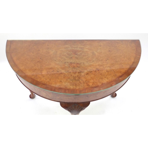 2042 - Burr walnut demilune side table, raised on cabriole legs carved with shells, 76cm H x 94cm W x 45cm ... 