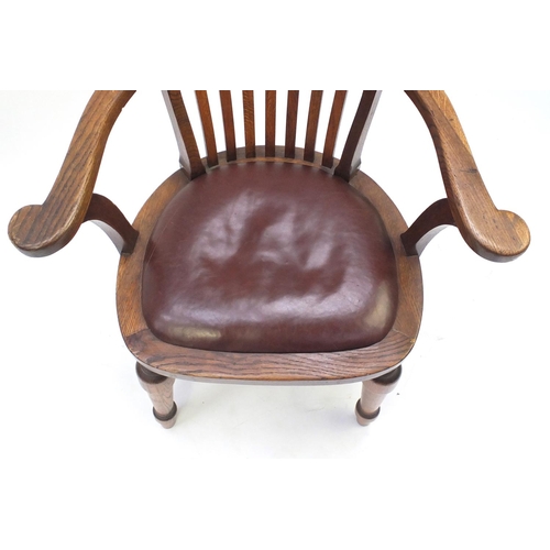 2019 - Oak framed smokers chair with red leather seat, 80cm high