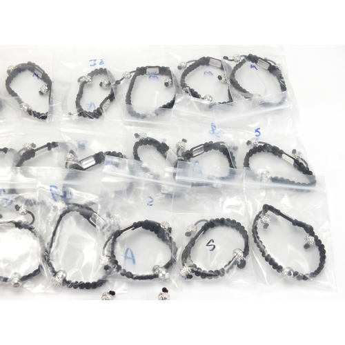 2813 - Collection of Mitroshina bracelets, with silver charms