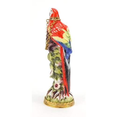 2473 - Halcyon Days hand painted porcelain scent bottle, with silver mounts in the form of parrot, with fit... 