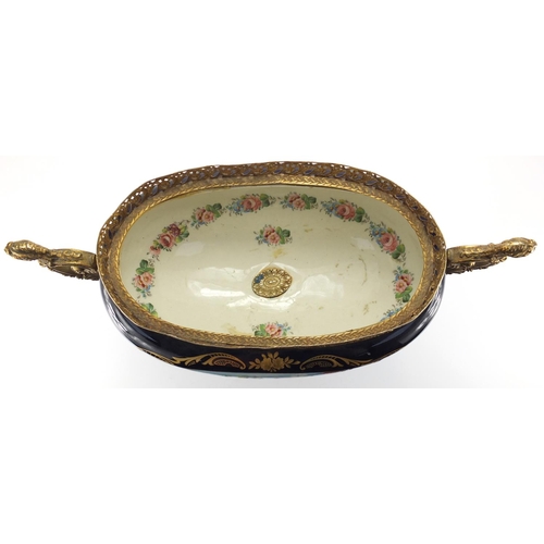 2324 - Ornate porcelain centre piece probably Limoges, with gilt metal twin handles, decorated with a oval ... 