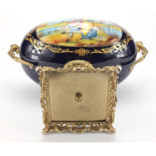 2324 - Ornate porcelain centre piece probably Limoges, with gilt metal twin handles, decorated with a oval ... 