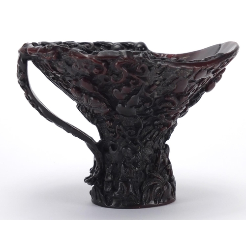 2177 - Chinese libation cup, carved with figures amongst fruiting vines, 11cm high