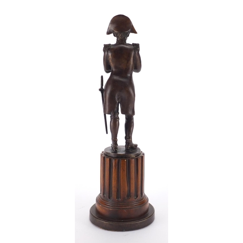 2168 - Patinated bronze study of Napoleon Bonaparte, on a wooden base, overall 48cm high