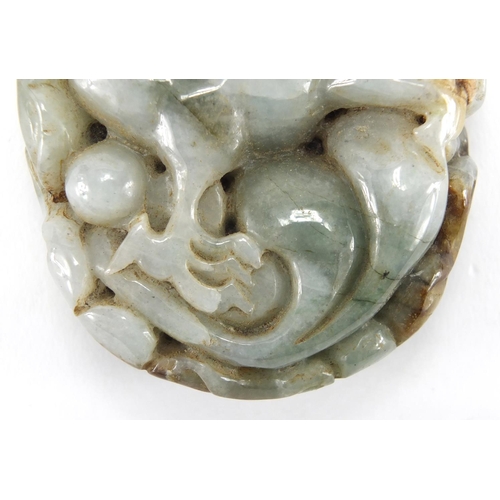 2512 - Chinese pale green jade touch stone, carved with a dragon, 8cm in length