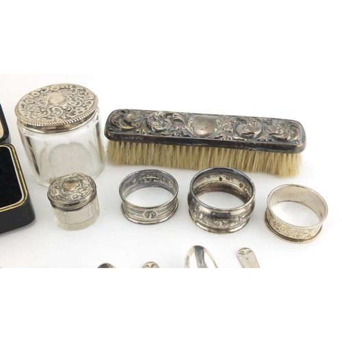 2546 - Silver objects including Georgian and later teaspoons, napkin rings and glass jars with silver lids,... 