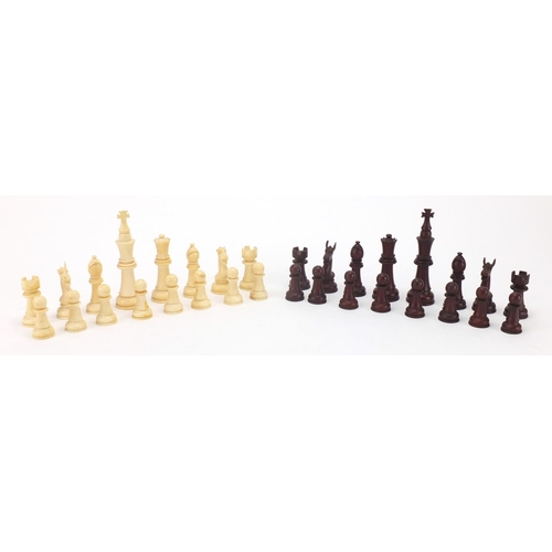 657 - Part stained turned and carved ivory chess set, the largest piece 9cm high